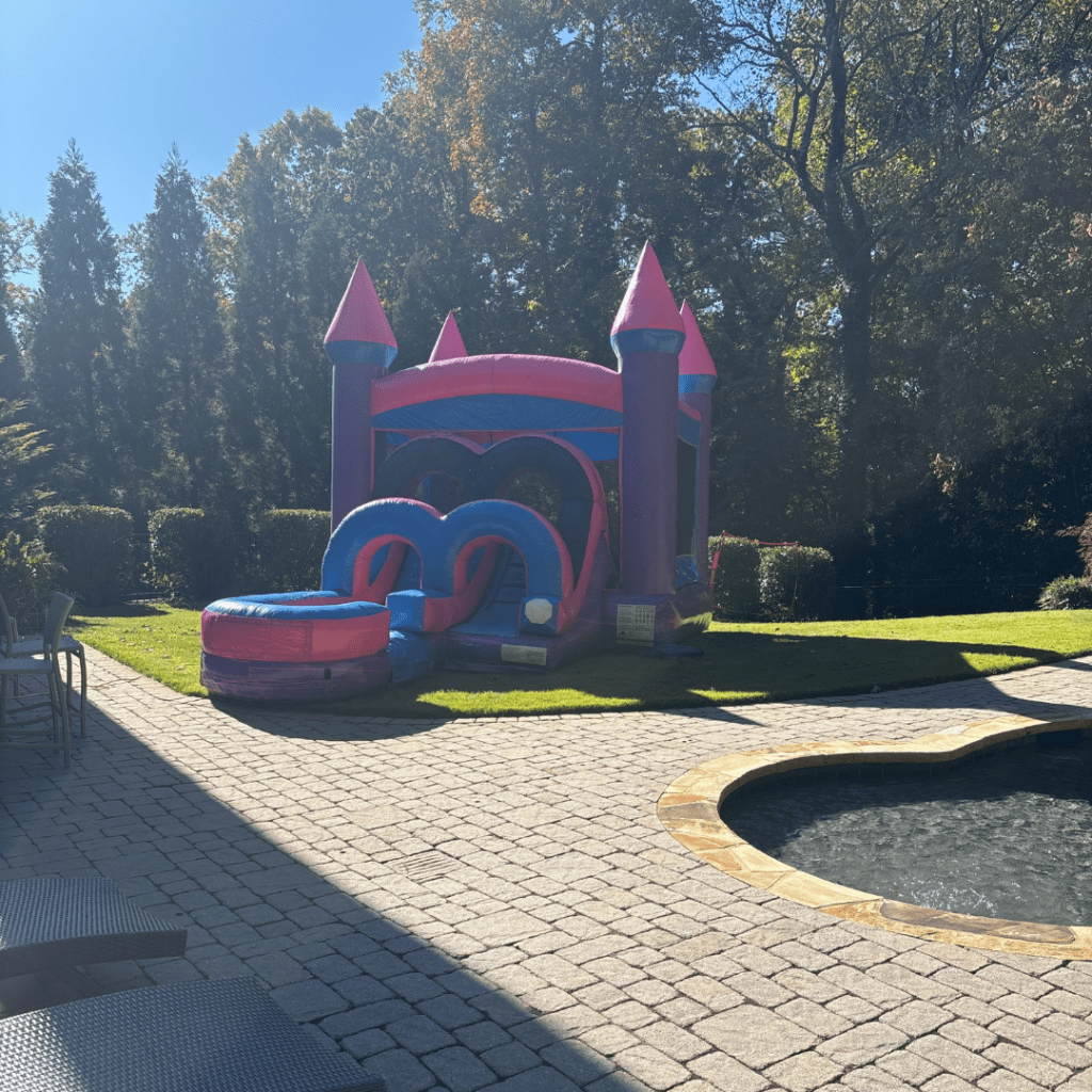 Bounce house rentals set up for a backyard birthday party in the Atlanta area by Marques Amusement Company