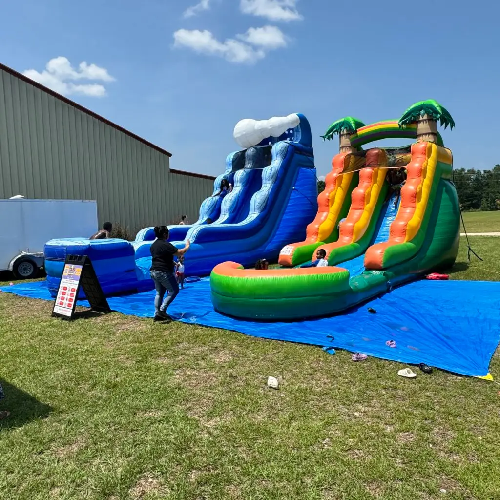 Graduation water slide rentals in Atlanta with dual inflatable slides for outdoor graduation parties