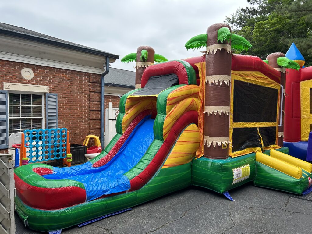 Island Breeze inflatable water slide and bounce house set up for a party in Lithia Springs GA