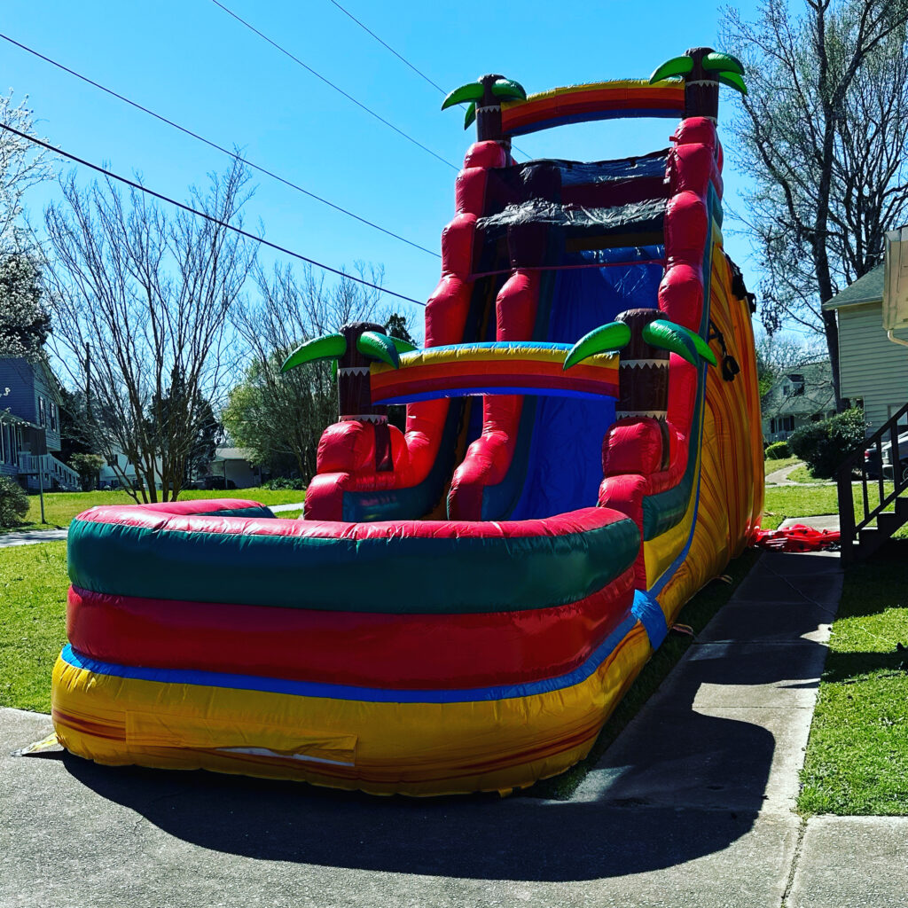 Tropical inflatable water slide set up at a home in Lithia Springs, Georgia for a party rental by Marques Amusement Company