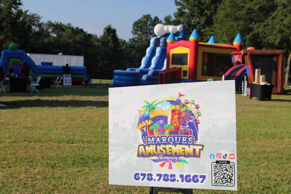 Outdoor event in Smyrna, Georgia featuring multiple bounce house rentals and inflatable rentals set up by Marques Amusement Company