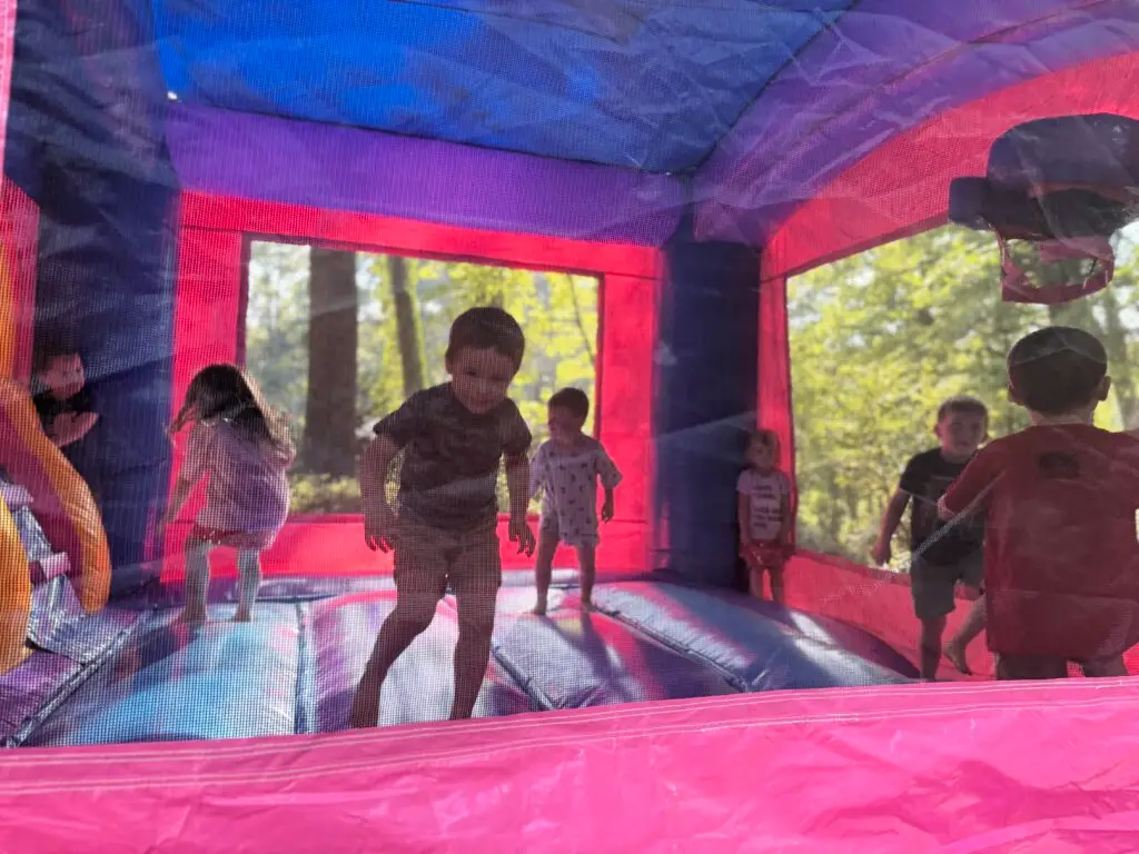 Kids enjoying bounce house rentals at a backyard party in Union City, GA