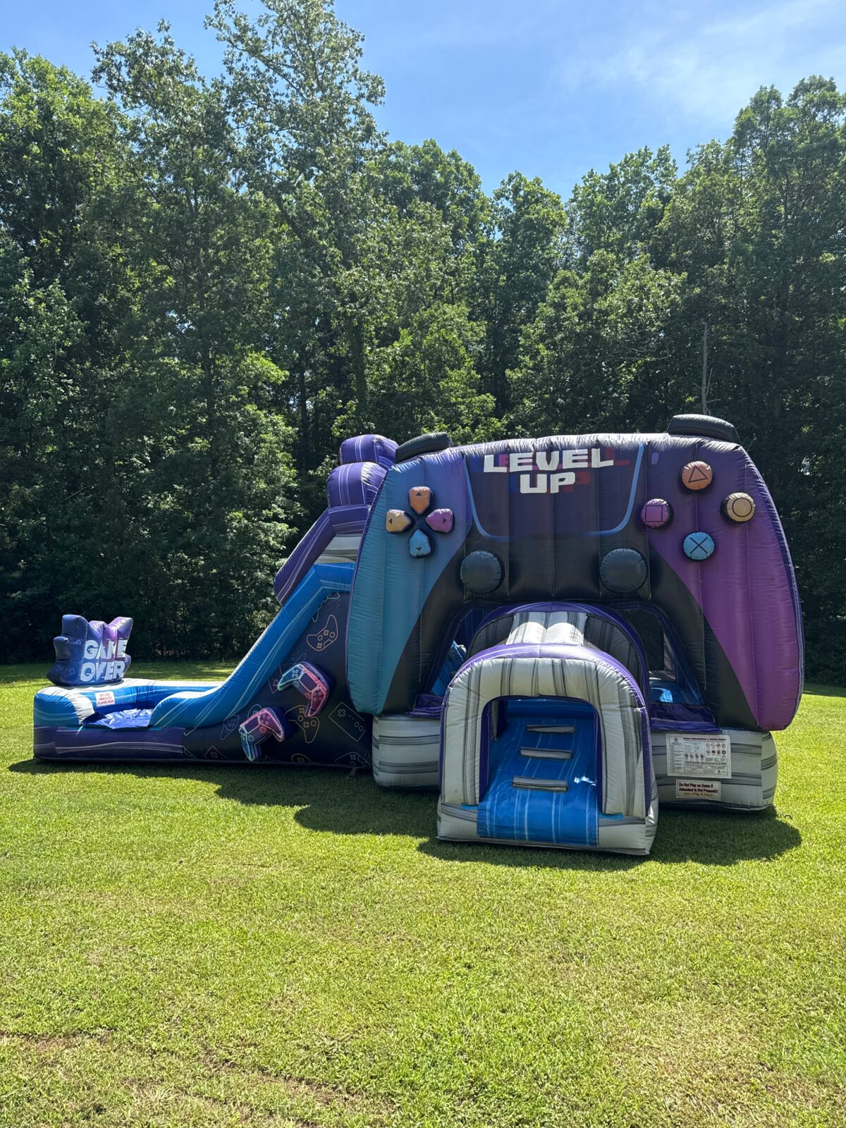 Level Up gaming-themed bounce house and slide combo
