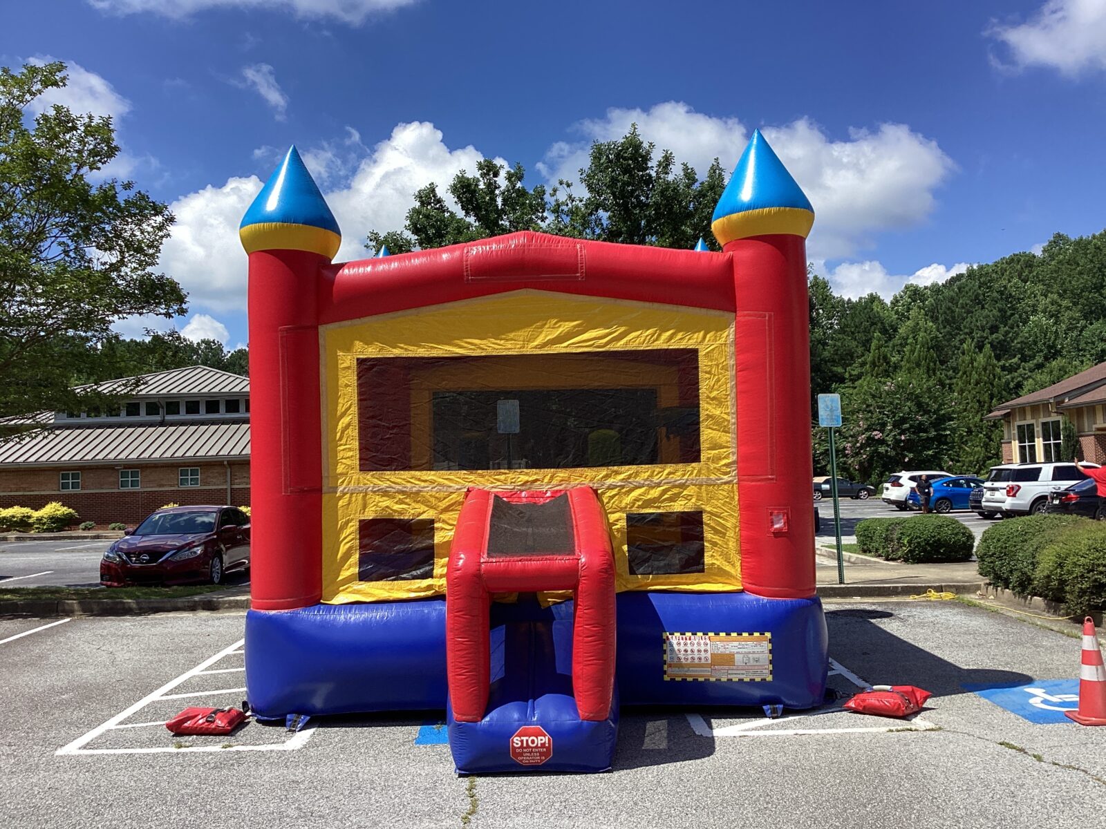 Classic red, yellow, and blue bounce house rental